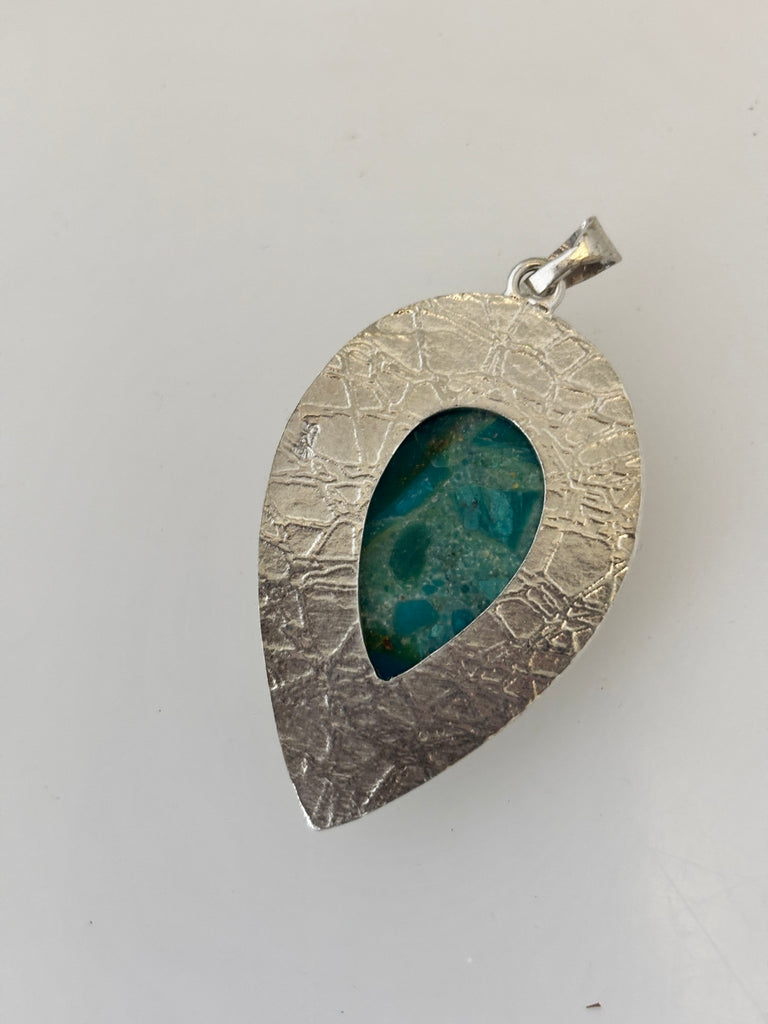 Back of handmade Peruvian Opal silver pendant showing the stone and water inspired texture