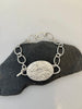 Back of Peruvian Opal silver bracelet with water inspired textured setting