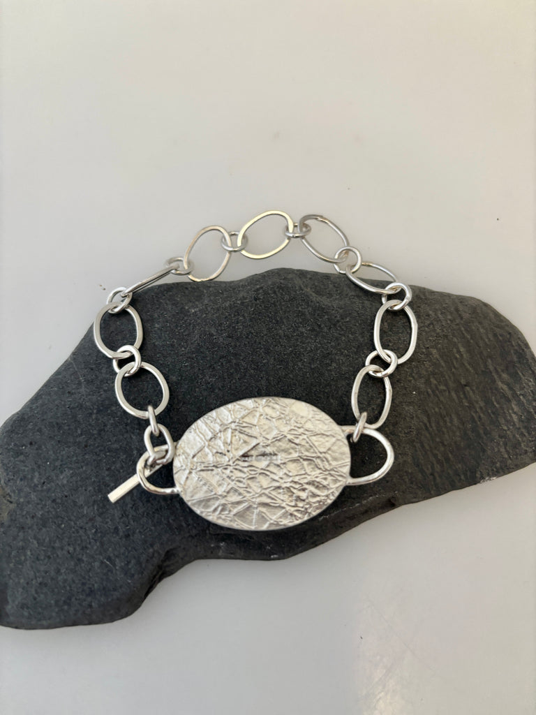 Back of Peruvian Opal silver bracelet with water inspired textured setting