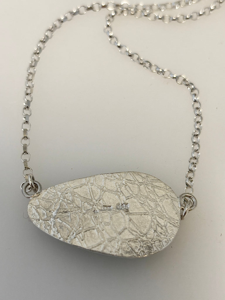 Back of Peruvian Opal silver necklace showing water inspired textured setting
