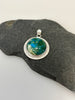 d Peruvian Opal sterling silver pendant with hand textured radiating line border