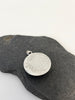 Back of round Peruvian Opal silver pendant with water inspired textured sterling silver