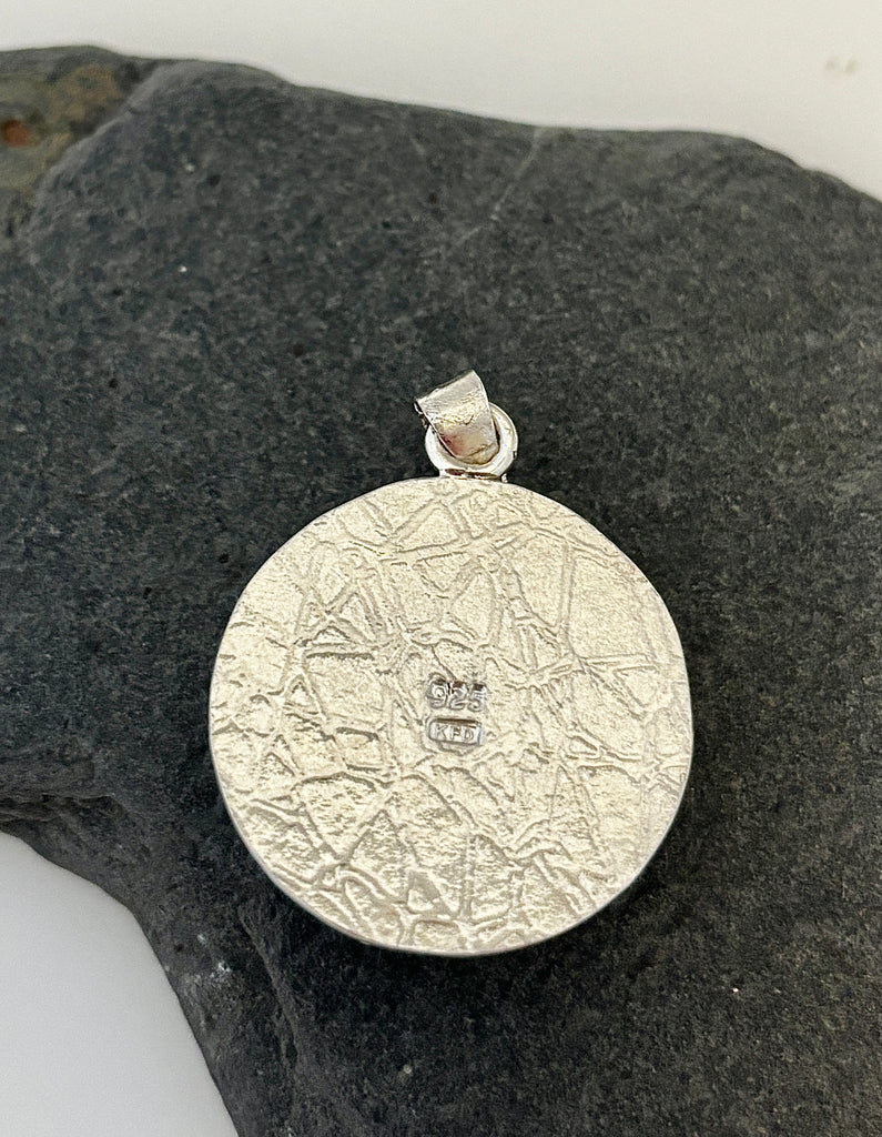 ack of round Peruvian Opal silver pendant with water inspired hand textured finish