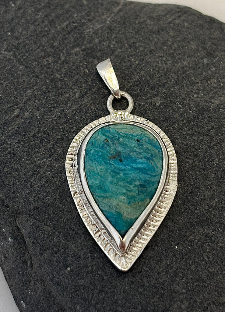 Teardrop Peruvian Opal sterling silver pendant with turquoise blue stone and radiating textured border