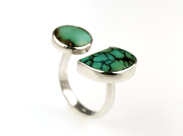 A striking open C - shaped design that celebrates the beauty of natural turquoise in two unique forms. - KFDJewellery